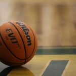 a close up of a basketball on a basketball court